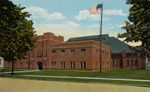 Postcard of Olean Armory with new administration building