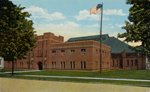 Postcard of Olean Armory with new administration building