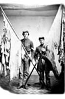 Sergeant John Lyon and Corporal Melvin Tucker with flags from the 16th New York, ca. 1865