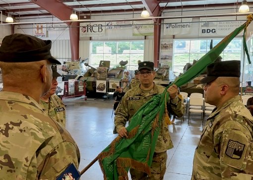 New York Guard Lt. Col. Lt. Col. Christopher St. Victor-de Pinho, accepts the colors of the New York Guard's 88th Area Command during change-of-command ceremonies conducted on Sept. 17 at the Museum of American Armor in Old Bethpage, New York. The New Yor