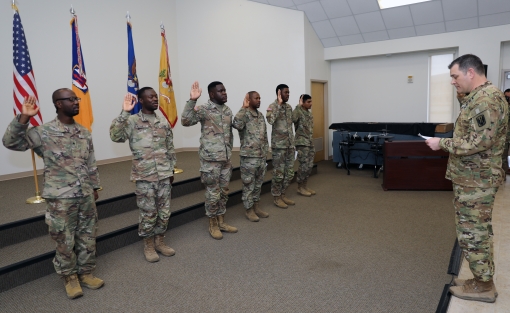  Seven New York Army National Guard Soldiers assigned to the 642nd Aviation Support Battalion reaffirm their oath of enlistment after becoming United States citizens during a March 24, 2023 ceremony at Fort Hood, Texas. The Soldiers of the 642nd are train