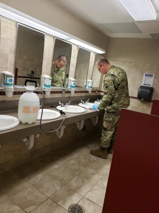 Guard member keeping things clean at Camp Smith 