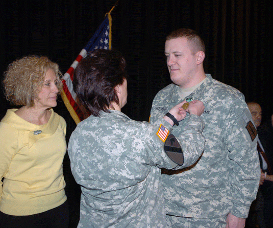 Soldiers from the 222nd MP Company receive awards during homecoming ceremony