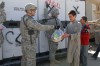 Army Specialist Gregory Dippel from Oswego, NY hands a bag of personal hygiene items to one of the residents of the Tahai Maskan orphanage in Kabul, Afghanistan October 23, 2008.