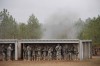 Members of HQ CJTF Phoenix VII take shelter as a live grenade goes off during urban operations training at Fort Bragg, NC. Feb. 2008