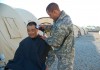 Spc. Victor Pagan gives Cpt. Sung H. Hwang a haircut outside of their sleeping tents Wednesday afternoon. Even though soldiers are in training, haircuts are a must to meet military standards.(Feb. 2008)
Photo by Spc. Jennifer L. Ocque