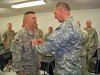 Brigadier General Paul Genereux promotes Master Sergeant Michael Hartzel from Schoharie to the rank of Sergeant Major during the general�s visit to Camp Alamo, Kabul, Afghanistan. U.S. Army Photo by Maj. Kathy Oliver