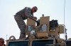 Staff Sgt. Dan Markle from Irondequoit, NY assigned to Company A, 2nd Battalion 108<sup>th</sup> Infantry, NYARNG based out of Geneseo, NY adjusts the .50 Cal Machinegun in the turret of his MRAP (Mine Resistant Ambush Protected RG 31 armored vehicle in the Camp Pheonix Motor Pool prior to moving out on a convoy. Markel is a member of police Mentoring Team assigned to support Afghan National Police in Jalalabad, Nangahar province, Afghanistan.