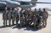 Chairman of the Joint Chiefs of Staff, Admiral Mike Mullen came to Afghanistan recently and a team from CJTF-Phoenix provided transportation.  Shown above from the left is SSG Fred Fah, SGT Darren Ringler, SPC Edward Nickles, SPC James Penlon, SSG Maurice Edwards, SGT Steven Watt, SPC Stephanie Wolfanger, Admiral Mullen, SGT Michael McGrath, SPC Jason Defazio, and Lt. Cdr Edward Ferguson.  The front row includes SPC Joe Adle, SPC Gary Dennis, TSgt Dennis Marks and SPC Douglass Moore. At right, SPC Adle is �coined� by the Chairman.