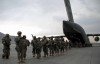 Members of the 27th BCT exit an Air Force C-17 at Kabul International Airport to begin their tour in Combined Joint Task Force Phoenix VII