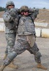 A 1st Army instructor positions Sfc. David Ford of the CJTF J-3 Section for search. Ford is from Syracuse, New York.(Feb. 2008)
Photo by Spc. Scott Jewel