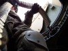 Spc. Brian Mengel, CJTF HQ, prepares his ammunition for Convoy Operations training.(Feb. 2008)
Photo by Spc. John Smith