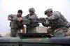 Members of Security Force Detachment (SECFOR) Bravo mount an M2 .50 cal. machine gun in preparation for training in urban operations at Fort Bragg, NC. From the left is Pvt. Arnoldo Madriz, Sgt. Mike Baronowski and Sgt. Javad Valad