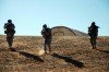 A fire team belonging to the 27th Brigade Combat Team part of �SECFOR� Charlie, moves down a slope during training rehearsals at Fort Bragg, N.C.