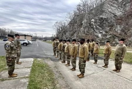 CAMP SMITH- Twenty-one New York Guard volunteers who completed their initial entry training held March 27 to 31, 2023 stand at attention for a final formation at Camp Smith Training Site on March 31, 2023. Completing the training course allows New York Gu