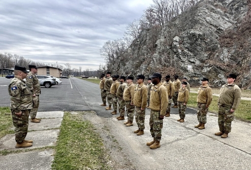 CAMP SMITH- Twenty-one New York Guard volunteers who completed their initial entry training held March 27 to 31, 2023 stand at attention for a final formation at Camp Smith Training Site on March 31, 2023. Completing the training course allows New York Gu