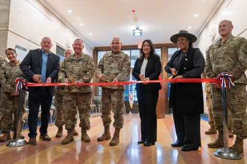 QUEENS--New York Army National Guard Maj. Gen. Raymond Shields the adjutant general of New York and New York State Office of General Services Commissioner Jeanette Moy, center, cut the ribbon during a ceremony openign the renovated Jamaica Armory in Queens New York N.Y. on Feb. 13 2025. This 190000-square-foot historic State Armory for the Division of Military and Naval Affairs was rehabilitated and modernized to meet the needs of todays New York Army National Guard. 