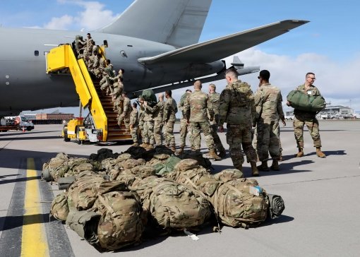 STOCKHOLM,SWEDEN- New York Army National Guard Soldiers from Troop C, 2nd Squadron, 101st Cavalry Regiment offload baggage from a U.S. Air Force KC-135 shortly after arriving in Sweden for exercise Northern Lights 26 April 25 2026. Northern Lights is a joint training opportunity in which U.S. and Swedish armed forces conduct realistic combat-focused exercises including area reconnaissance and screening operations to build combat readiness and enhance combined operational capacity. The New York National Guard has a State Partnership Program relationship with Sweden's military.