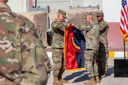 CENTRAL COMMAND AREA--Maj. Gen. Jack James (left), the commander of the 42nd Infantry Division, and Command Sgt. Maj. Arnold Reyes (right), the 42nd Infantry Division Command Sgt. Major, case the division's colors during the Task Force Spartan transfer of authority ceremony June 6 in the Middle East. The 42nd Infantry Division headquarters mobilized over 500 Soldiers for deployment to serve as the command of Task Force Spartan, the Army force in the region, on May 24, 2026. While deployed the 42nd Infantry Division Soldiers assumed responsibilities for operations during the ongoing conflict with Iran. The 36th Infantry Division is assuming the responsibility of leading Task Force Spartan.