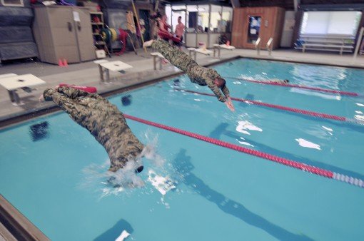 Airmen swim for a badge