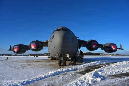 Maintainers prepping C-17 for worldwide missions