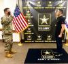 Guard father administers enlistment oath to son