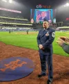 Airman honored for service at Met's game 