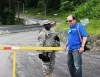  Captain Mark Getman, (R) Deputy Public Affairs Officer of the New York Guard portrays a local reporter attempting to access Camp Smith Training Site from the Force Protection soldier during an exercise for local first responders held in June at the training site. 

