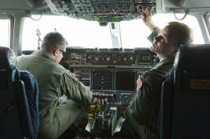 New York Air National Guard Capt. Paul Sloan and 1st Lt. Joshua Early of the 137th Air Lift Squadron of the 105th Airlift Wing , prepare flight controls before take off from Volk Air Field, Wis., July 16. Numerous states joined forces at Volk Air Field for the Patriot Excercise 2013. 112th Mobile Public Affairs Detachment photograph by Pfc. Christopher Enderle/Released.