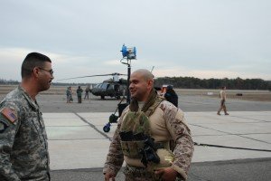 EAST FARMINGDALE--New York Army National Guard Sgt. Dennis Raffanelo and Sgt. Herbert Gomezmaldonado, both members of the 1st Battalion, 69th Infantry, on the set at Republic Airport here during the filming of scenes for the Universal Television TV show "State of Affairs." Gomezmaldonado portrayed a Navy SEAL in the TV show, while Raffanelo drove a Humvee used to dress the set during the production. (New York Army National Guard Photo by Maj. Alvin Phillips, Joint Force Headquarters)


