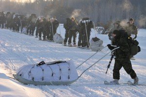 Canadian Soldiers and a few New York Army National Guardsmen on the move during winter warfare and survival training conducted in Gogama, Ontario in March. Nine members of the 1st Battalion 69th Infantry took part in the training exercise. (Photo Courtesy Canadian Forces by Cpl Laviolette )