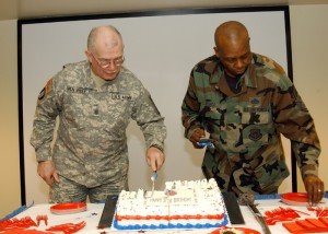 Command Chief Master Sergeant Hardy Pierce (right)
and Command Sergeant Major Robert Van Pelt finish cutting the National Guard Birthday cake in the Department of Military and Naval Affairs auditorium in Latham, N.Y. Dec. 13, 2007.
Photo by: Sgt. 1st Class Steven Petibone, 42nd Combat Aviation Brigade