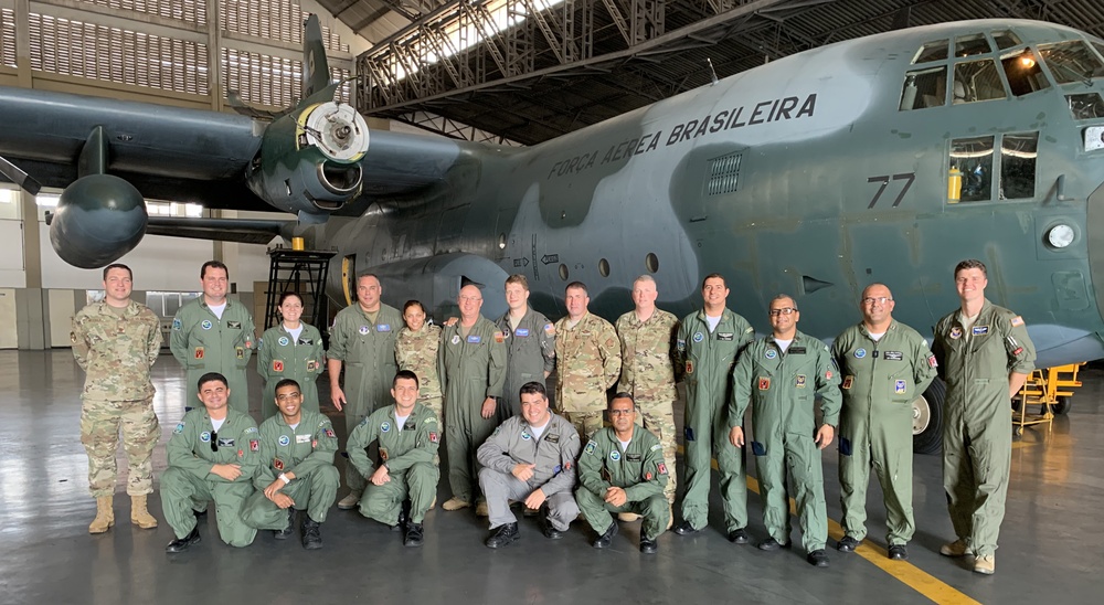 
                Airmen from the New York Air National Guard's 109th Airlift Wing pose with members of the Brazilian Air Force's 1st Squadron,  1st Transport Group at Galeao Air Base in Rio de Janerio  during a State Partnership Program exchange in September, 2019. The 109th Airlift Wing specializes in flying in the Antarctica and Arctic and discussed Antarctic flying with their Brazilian counterparts. The  New York National Guard entered into a state partnership with Brazil in March, 2019. (Courtesy photo)            