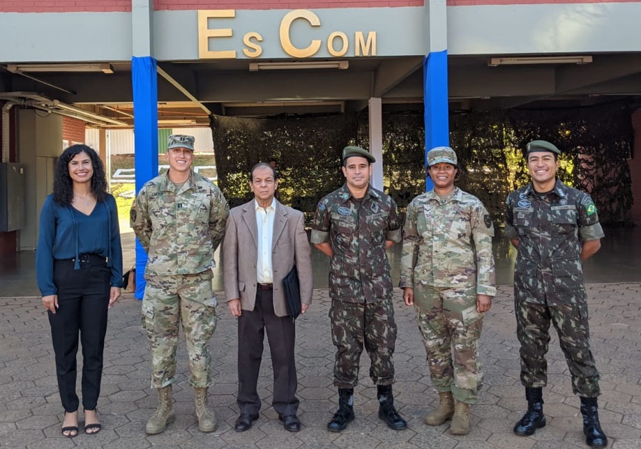 
                New York National Guard cyber protection experts Capt. Andrew Carter, the information systems officer for the 42nd Infantry Division headquarters battalion, second from left,  and Chief Warrant Officer 2 Nefertiti Stokes, a member of the 173rd Cyber Protection Team, second from right, stand with Brazilian counterparts during a visit to the Brazilian military communications school in Brasilia, Brazil on August 17, 2022. The two Americans took part in Brazil’s annual Cyber Guardian Exercise as part of the New York National Guard State Partnership Program relationship with Brazil. ( Photo Courtesy Capt. Andrew Carter)            