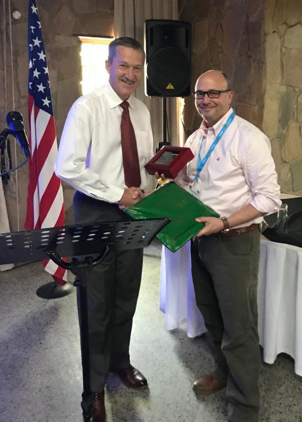 
                South African Brig. Gen.Carel Laubscher, (left)  the Director Education Training and Development Systems Integrity, of the  Human Resources Division, Republic of South Africa Department of Defense receives a gift from New York Army National Guard Brig. Gen. Michel Natali, the Assistant Adjutant General for Army, during the annual Defense Committee Meeting between South African and U.S. officials in Pretoria, South Africa, on Nov. 6, 2019. The New York National Guard has had a State Partnership Program training and exchange relationship with the South African National Defence Force since 2003.            