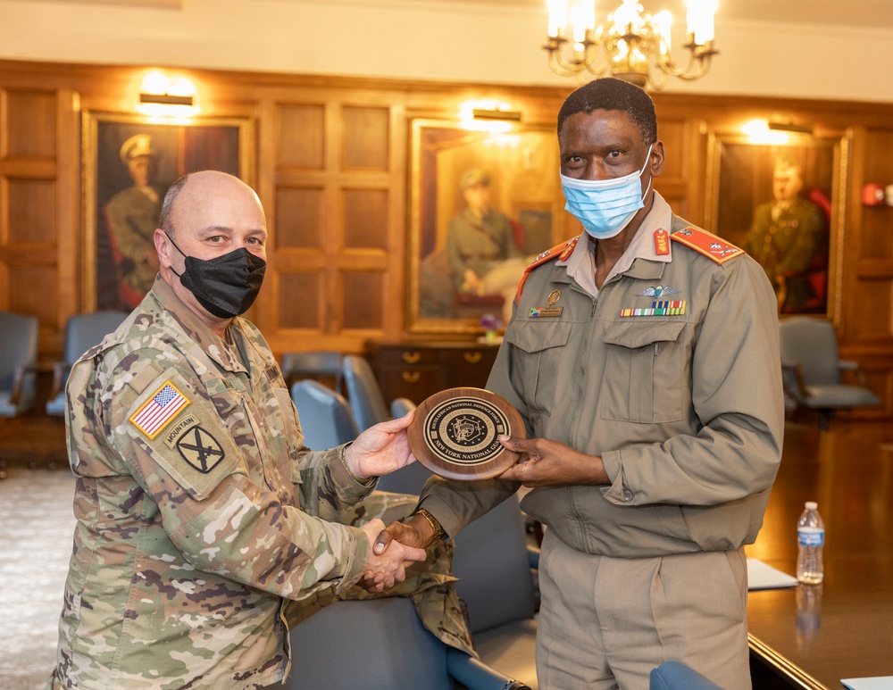
                New York National Guard Maj. Gen Michel Natali, the assistant adjutant general, presents a plaque to Brigadier Gen. Richard Maponyane, the South Africa Defense Attaché based in Washington D.C., , in Manhattan on December 9, 2021 during a meeting held to discuss State Partnership Program initiatives. The New York Army National Guard and South Africa have participated together in the State Partnership Program since 2003 and was the first partnership in Africa. (New York Army National Guard Staff Sgt. Jonathan Pietrantoni)            