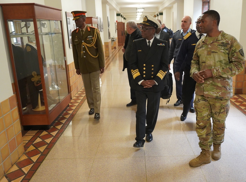 
                New York Army National Guard Major Anthony McLean, the executive officer of the 369th Sustainment Brigade, conducts a tour of the brigade’s historic Harlem Armory, in New York, for a delegation of South African officers and academics on April 21, 2022. The South Africans met with officials at the United States Military Academy at West Point on April 20 to sign an agreement setting up an exchange program with South Africa’s officer education program. The New York National Guard has had a State Partnership Program agreement with the South African National Defence Force since 2003. (U.S. Air National Guard photo by Major Michael O’Hagan)            