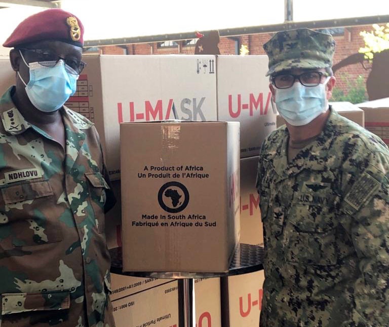 
                South African Military Health Service Deputy Surgeon General, Maj. Gen. Noel Ndhlovu and U.S. Navy Captain Steven Morgenfeld, the Senior Defense Attaché at the U.S. Embassy mark the delivery of N95 anti-virual masks provided to the Military Health Service by the U.S. Embassy in Pretoria, South Africa, on April 23, 2020. The use of humanitarian funds to purchase the personal protective equipment marks the determination of the two nations to work together to control the coronavirus pandemic.  (U.S. Army National Guard photo by Lt. Col. Al Phillips)            