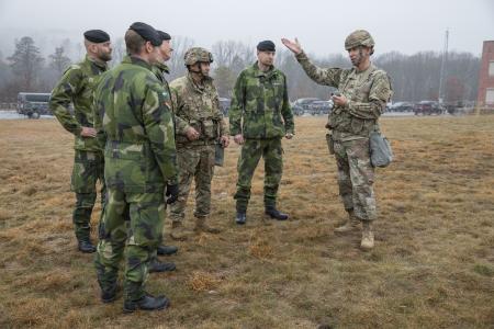 FORT INDIANTOWN GAP, PENNSYLVANIA--New York Army National Guard Maj. Gen. Jack A. James Jr., right, the commander of the New York National Guards 42nd Infantry Division, speaks with Swedish Army soldiers during the divisions Warfighter 25-3 exercise at Fort Indiantown Gap, Pa., Jan. 31, 2025. The Swedish soldiers participation with the New York Army National Guardsmen during Warfighter Exercise 25-3 marks their second visit with the 42nd Infantry Division and their first experience working with the United States in a division-level warfighter exercise.