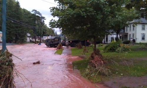 New York Army National Guard Engineer Soldiers Walk Through the Flood to Rescue Residents
